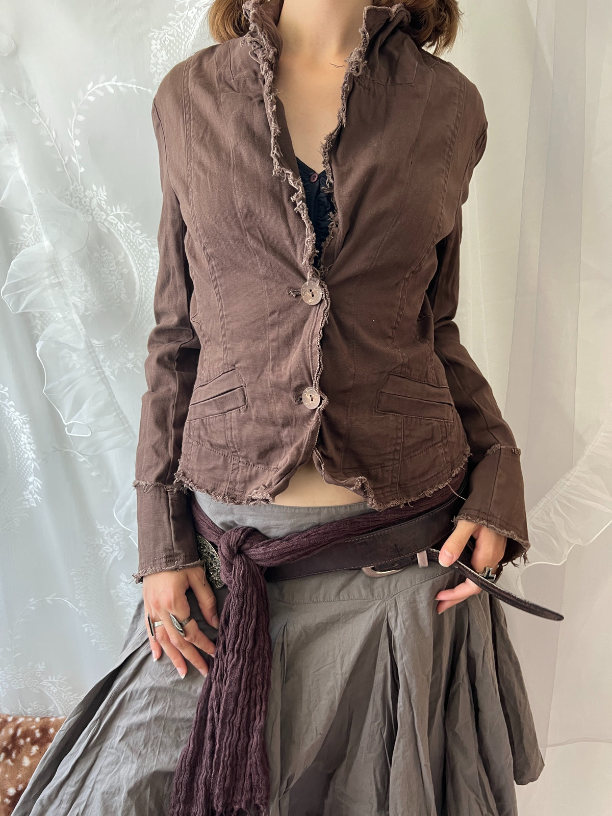 Brown cropped jacket with frayed hem and button details