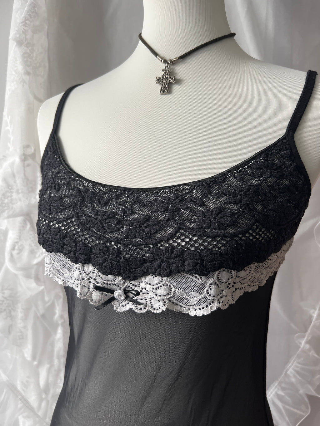 Black lace cami top with white lace trim and bow detail