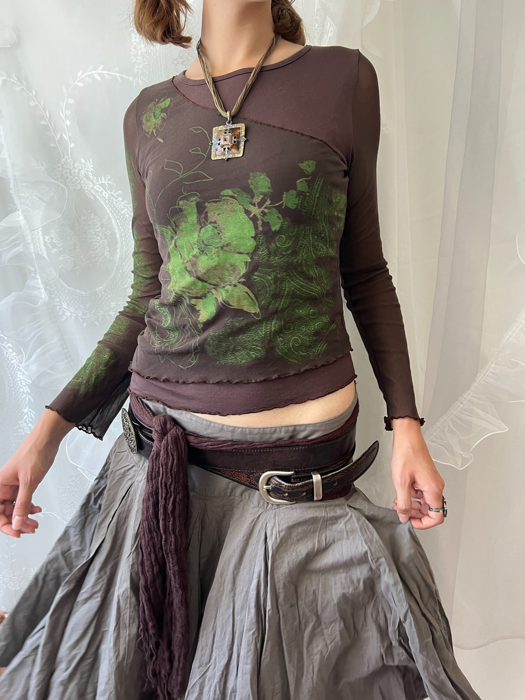 Brown sheer mesh long sleeve top with green floral design