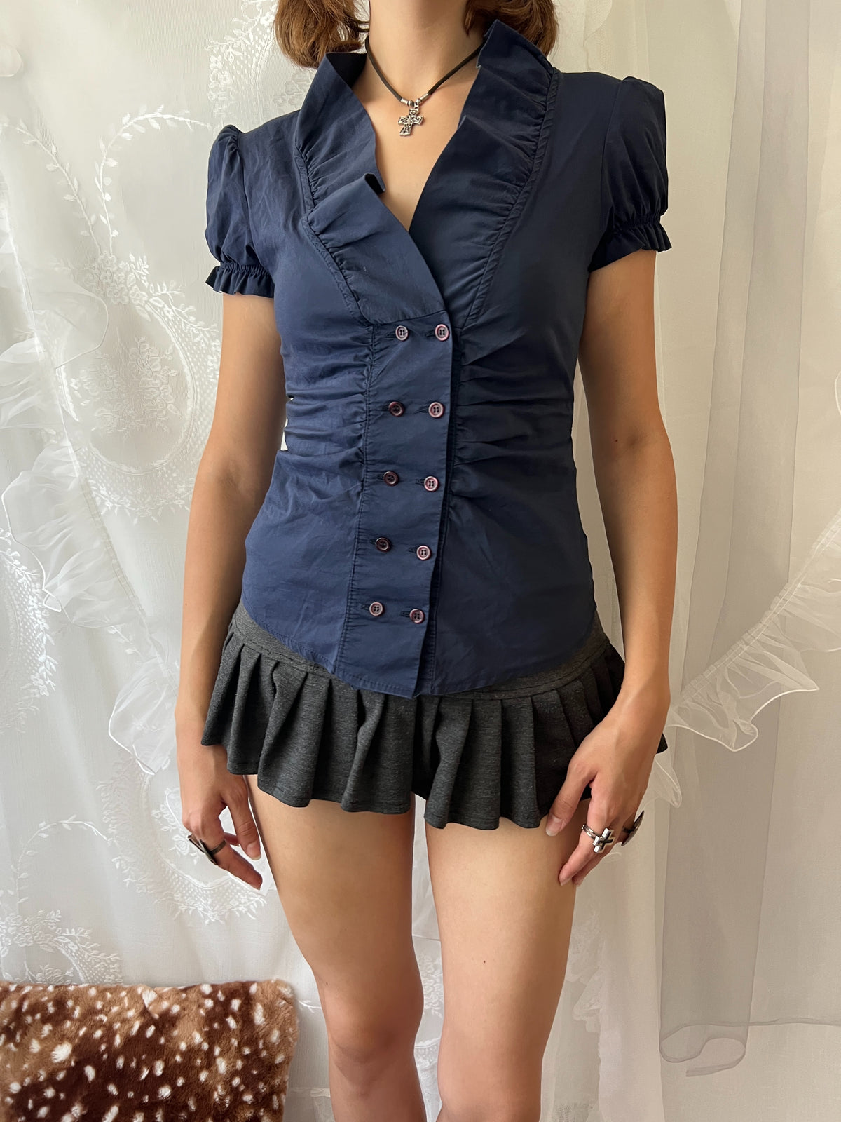 Navy blue button up blouse with ruffle details