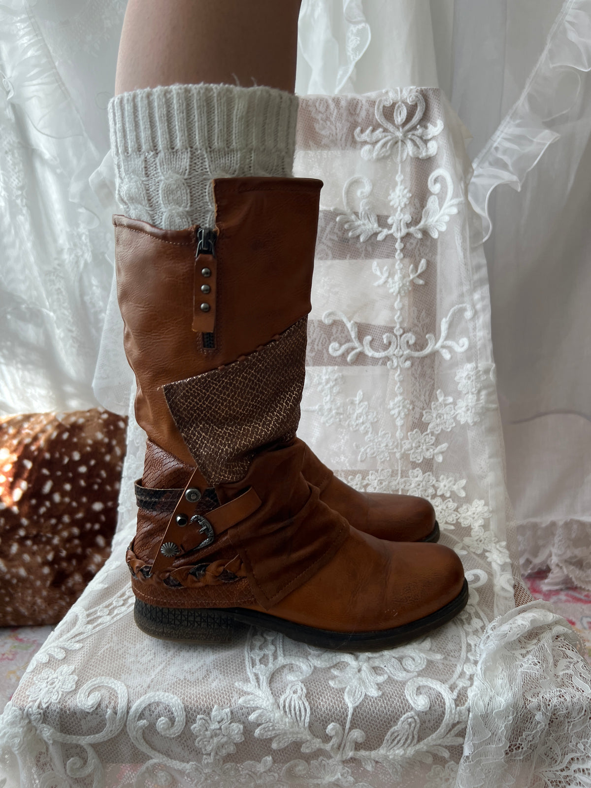 Brown boots with snake skin pattern