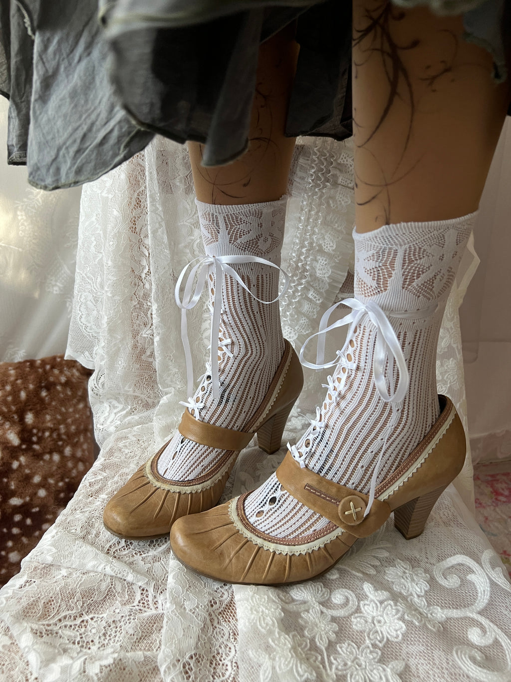 Tan Mary Jane heels with white lace trim and button detail
