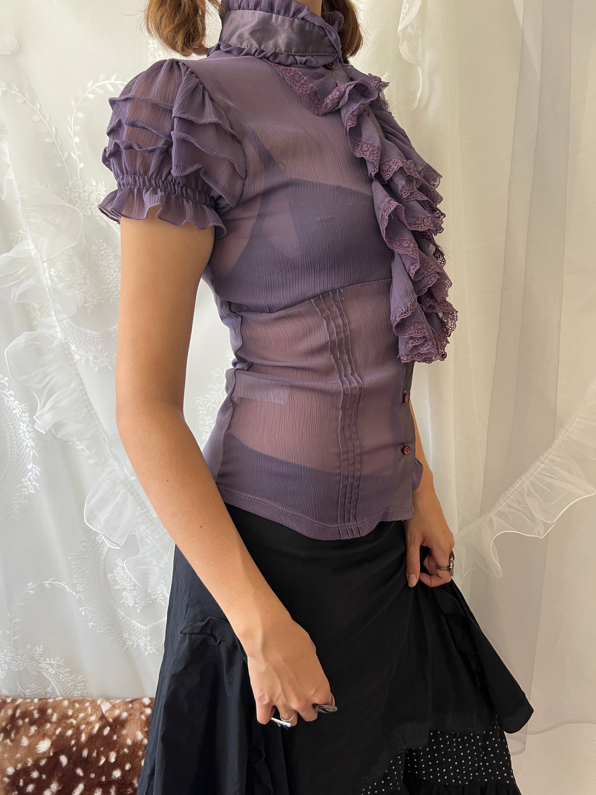 Purple sheer blouse with ruffles and lace details