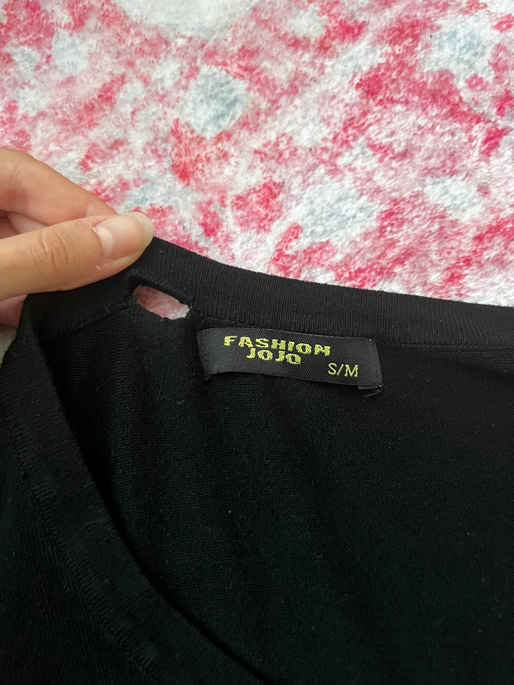 Black long sleeve top with button up front and flower detail