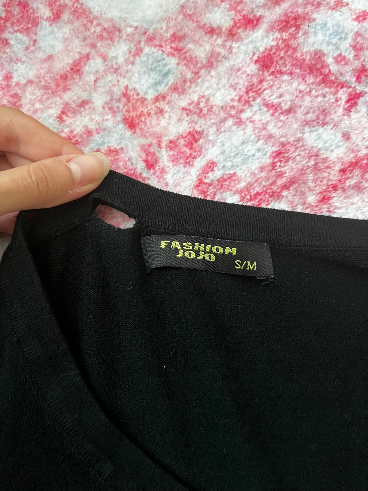 Black long sleeve top with button up front and flower detail