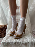 Tan peep toe heels with bow