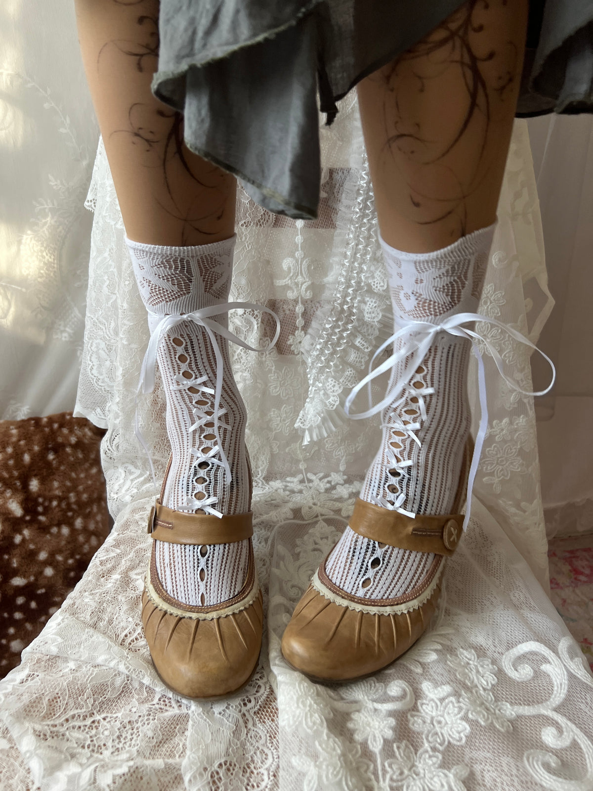 Tan Mary Jane heels with white lace trim and button detail