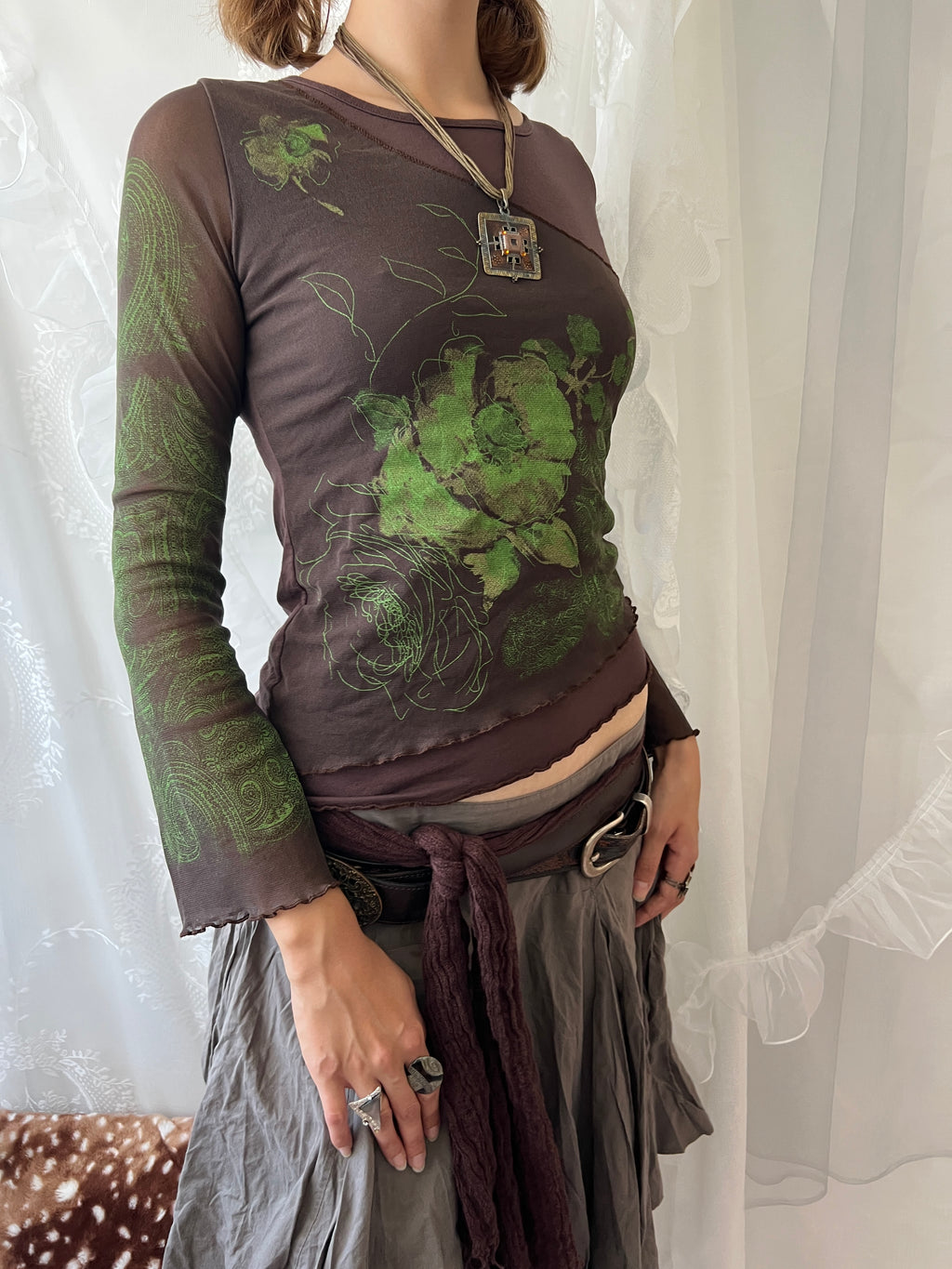 Brown sheer mesh long sleeve top with green floral design