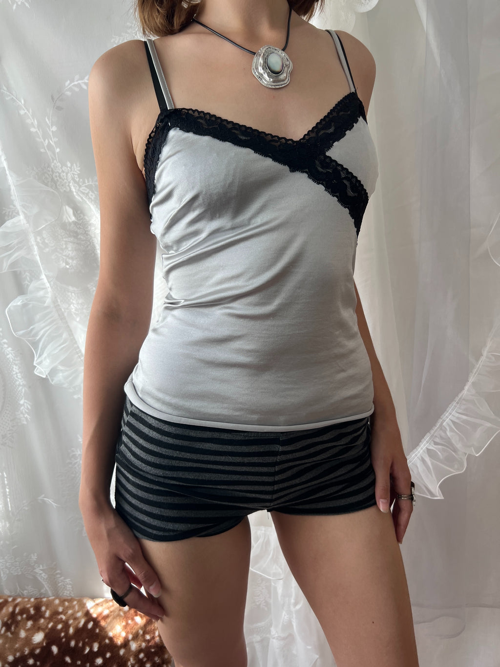Black lace silver cami top with adjustable straps and tie detail