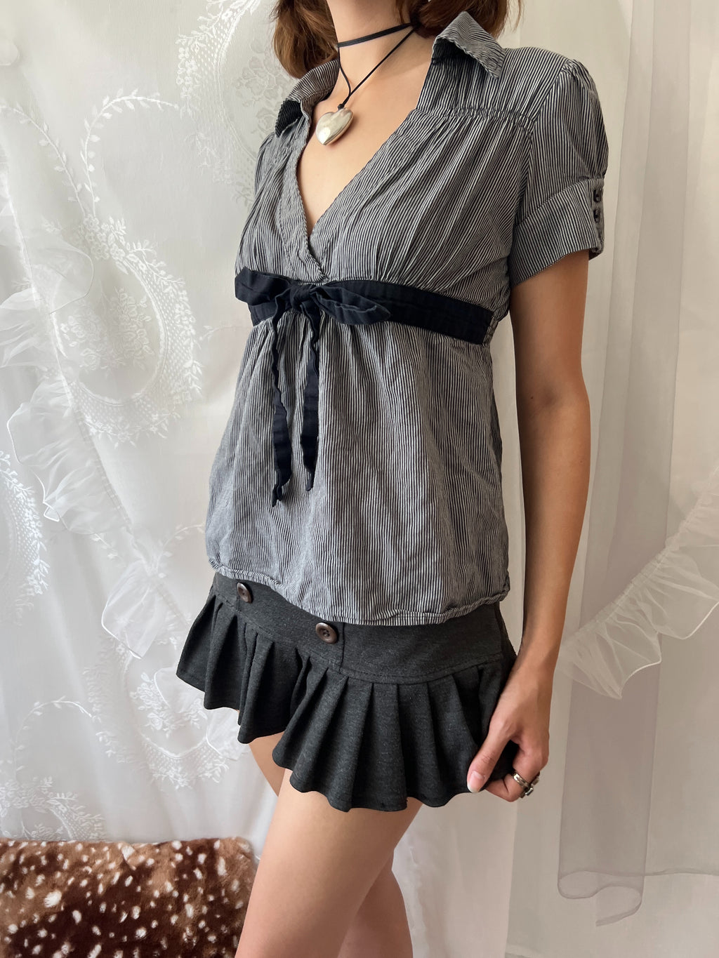 Grey pinstriped belted blouse with black ribbon tie