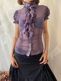 Purple sheer blouse with ruffles and lace details