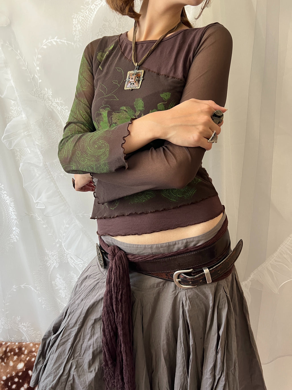 Brown sheer mesh long sleeve top with green floral design
