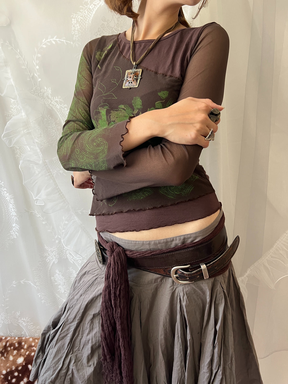 Brown sheer mesh long sleeve top with green floral design