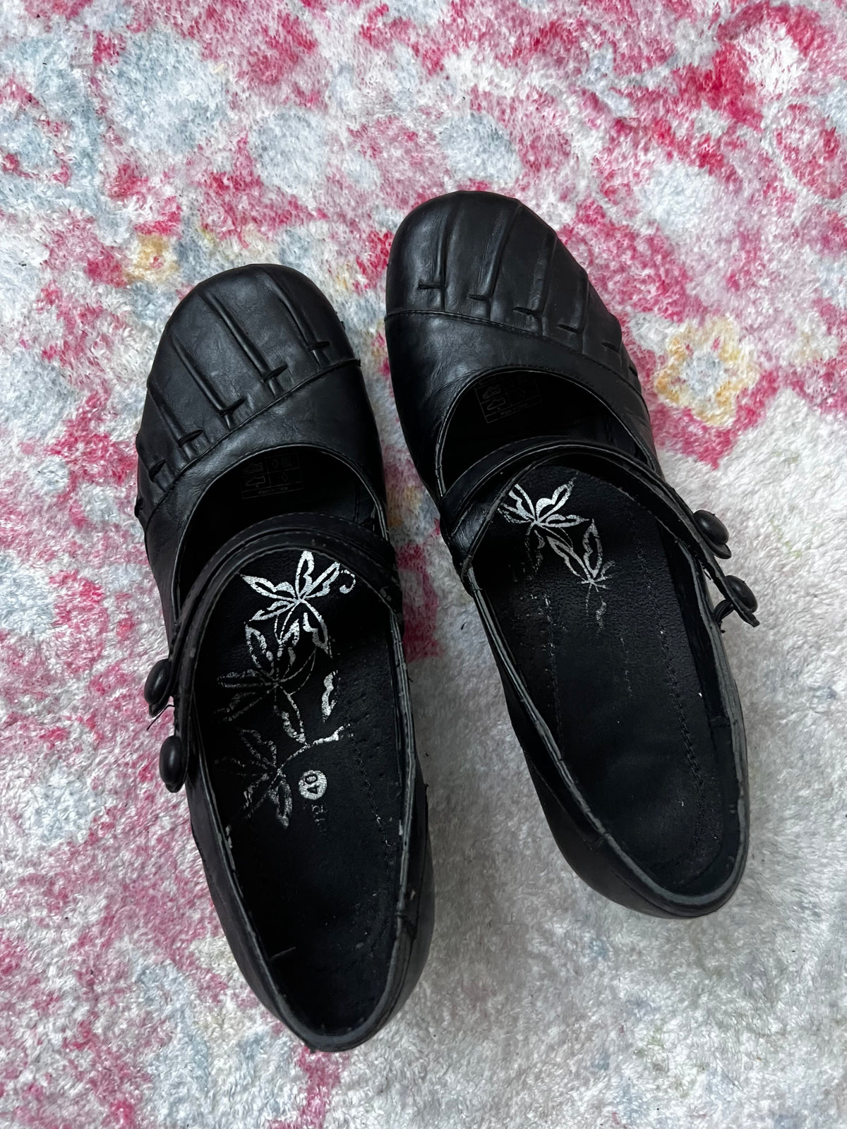 Black Mary Jane shoes with button detail